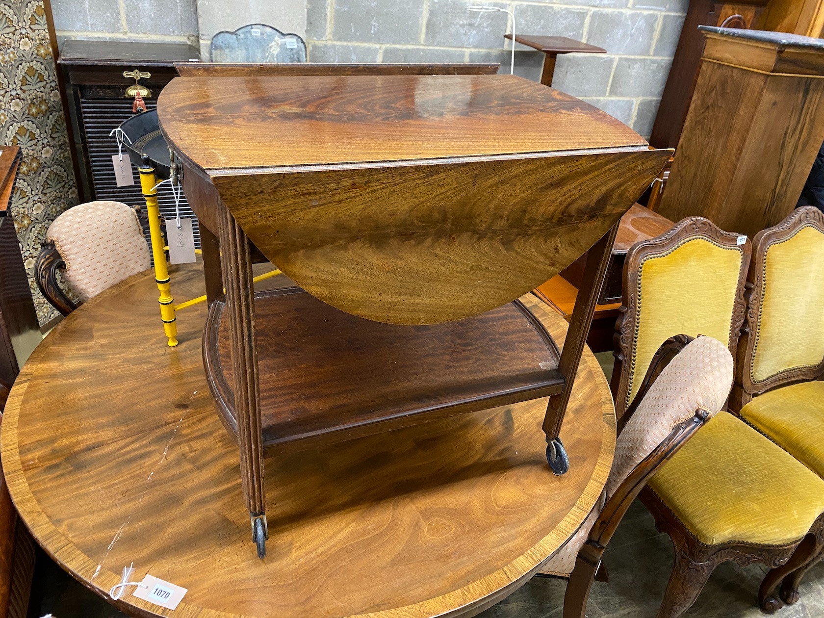 A mahogany drop flap tea trolley, width 69cm, depth 51cm, height 59cm